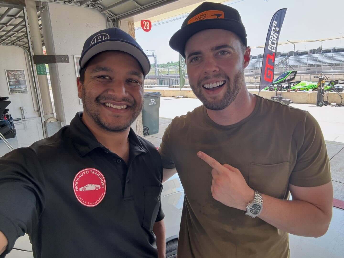 Nick (left), founder of Nick's Auto Transport, at Circuit of the Americas with a customer.