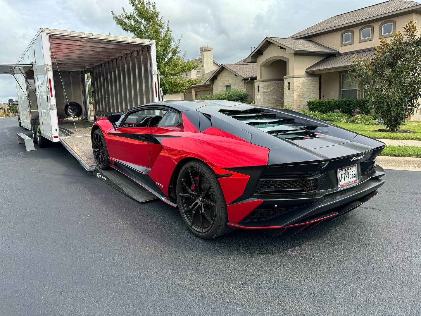 Being a local means golfing and passing this house every time thinking “I wonder what they drive” and then hauling it 😁. This 2017 Lamborghini Aventador S is wrapped in a super cool chrome red. I think it matches the personality of the car perfectly. 
.
.
Don’t forget to use code NAT10 on raceramps.com to get 10% off your order!
.
.
.
.

#nicksautotransport #dreamtransporter #enclosedtransport #carhauler #carsofinstagram #carswithoutlimits #supercar #supercarsofinstagram #toyhauler #atc #aluminumtrailer #ford #powerstroke #platinum #carporn #raceramps #lamborghini #lambo #lambro #aventador
